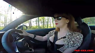 British full-grown Red fingers her cunt in the car again